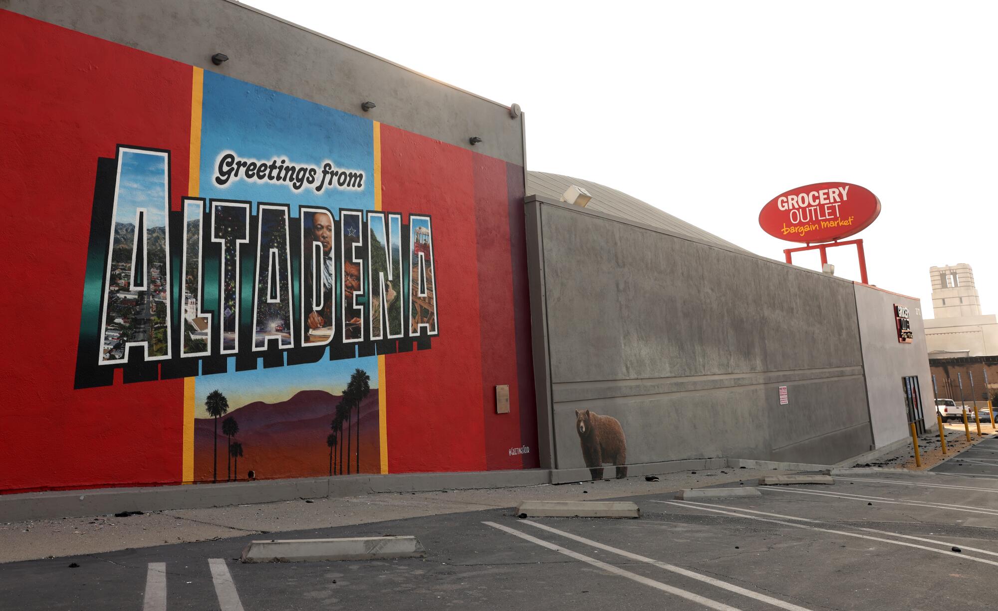 A "Greetings from Altadena" mural on the wall of a building.