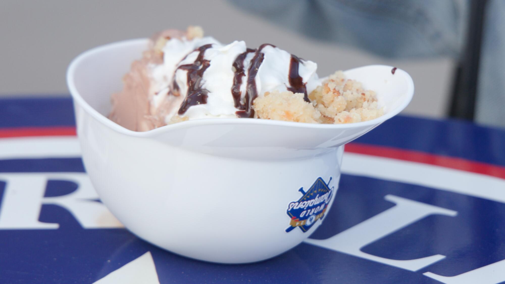 The weet bread sundae from Dodger Stadium is served in a small white plastic batting helmet