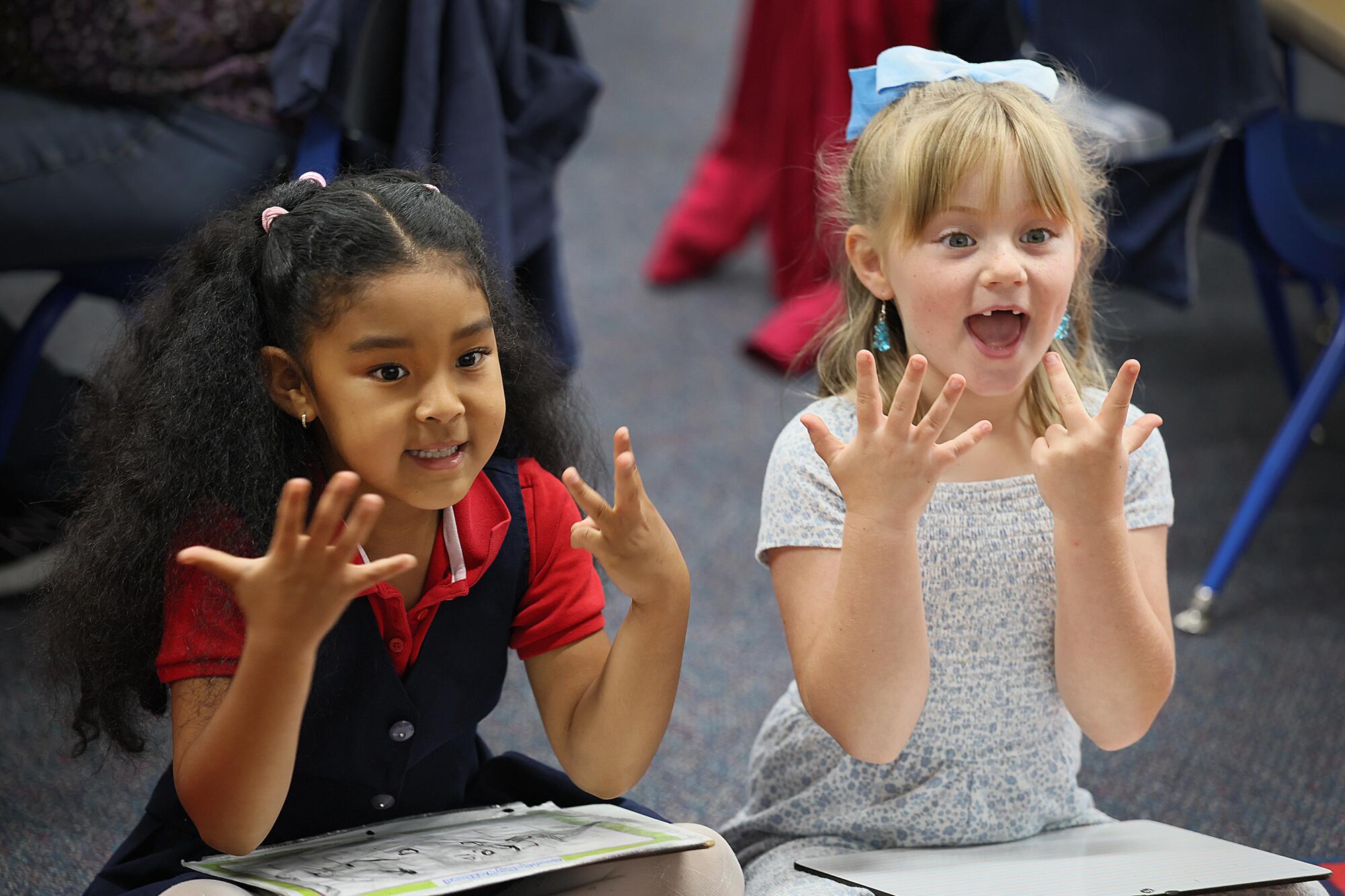 Kindergarten students answer questions on a literacy lesson at Mark Twain Elementary School in Long Beach.