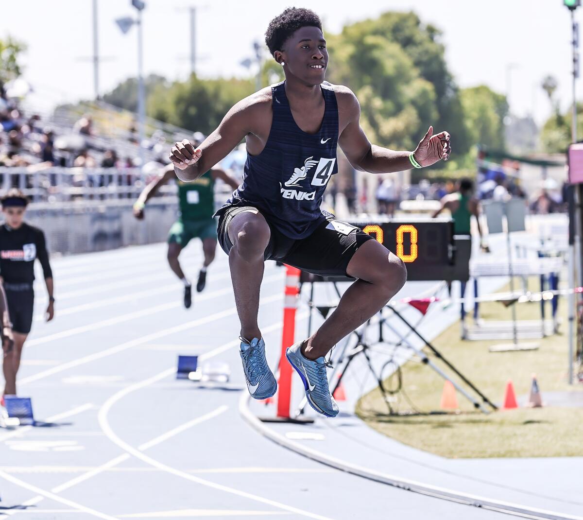 Nathan Santa Cruz of Venice smiles as he loosens up before running in the City Section 400 prelims at Birmingham High.