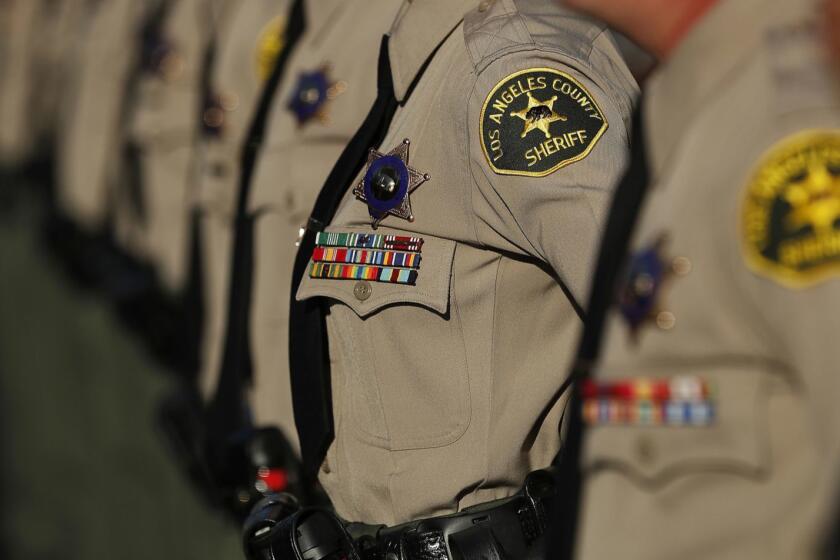 LOS ANGELES, CA-OCTOBER 27, 2017: Los Angeles County Sheriff's deputies stand at attention during the inspection portion of their graduation ceremony at the Biscailuz Training Center of the Los Angeles County Sheriff's Dept. in East Los Angeles on October 27, 2017. (Mel Melcon/Los Angeles Times)