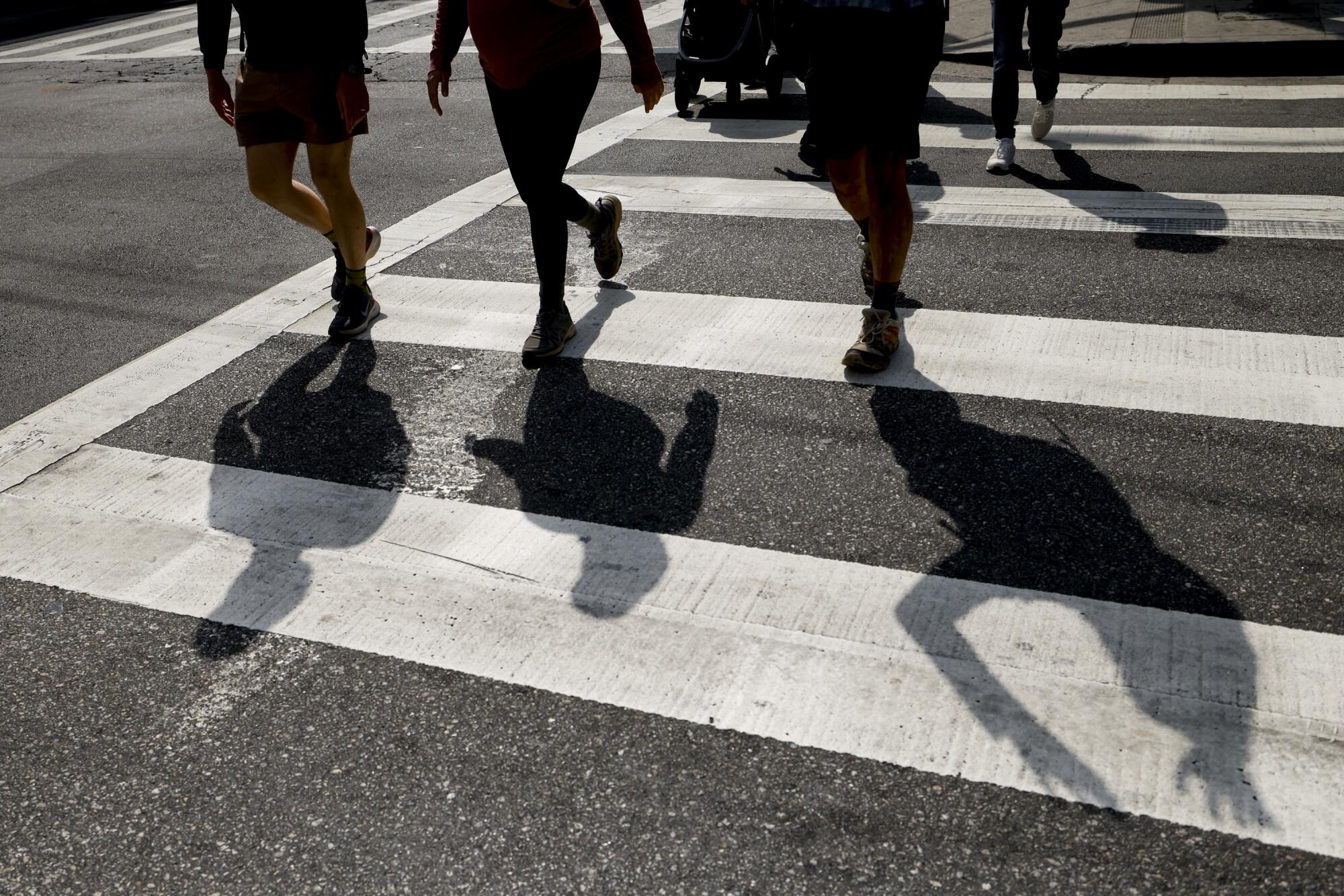 Shadows make an appearance on Pico Boulevard during the group's long walk.