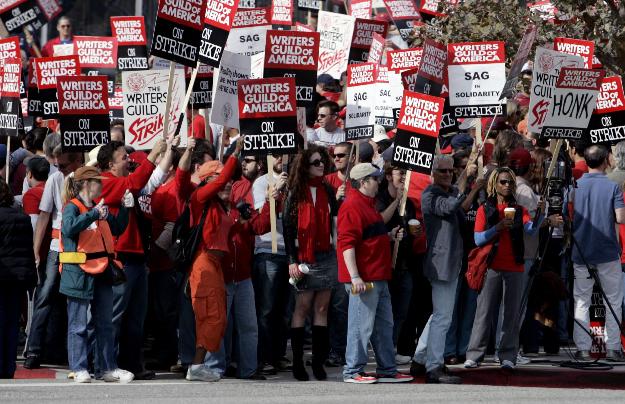 WGA members and supporters picket.
