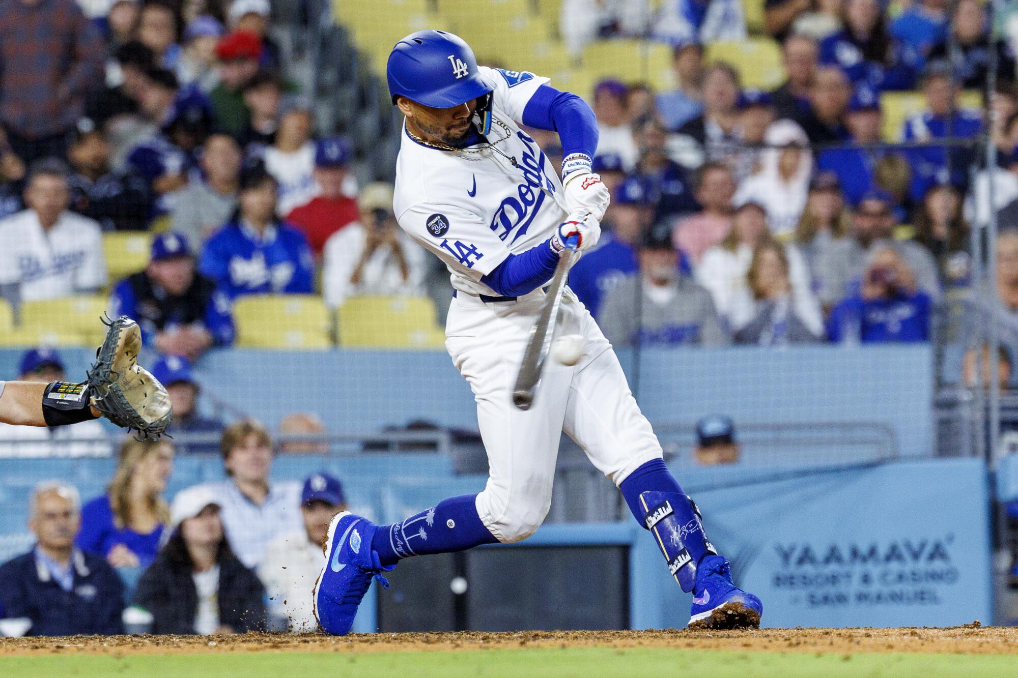 Dodgers shortstop Mookie Betts hits a two-run double against the Athletics at Dodger Stadium.