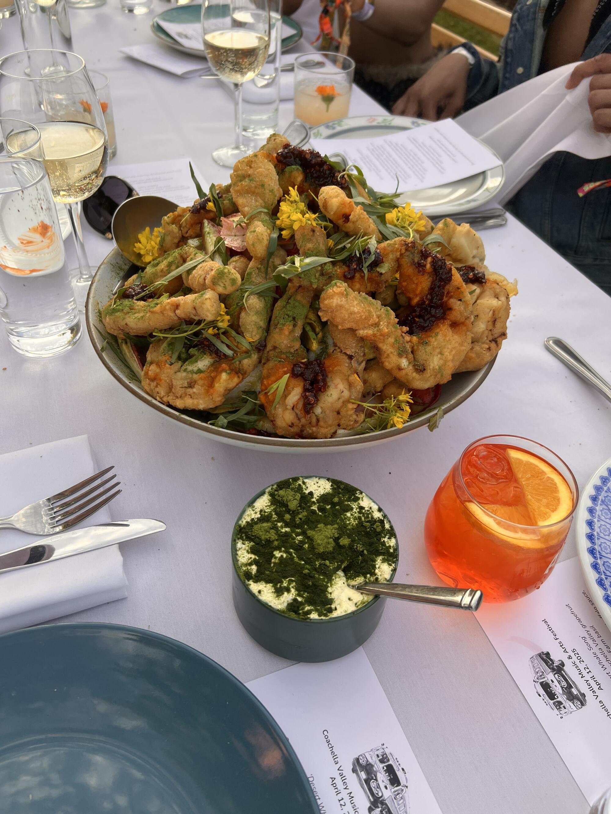 Battered frog legs with a side of blue-cheese labneh at chef Diego Argoti's Outstanding in the Field dinner.
