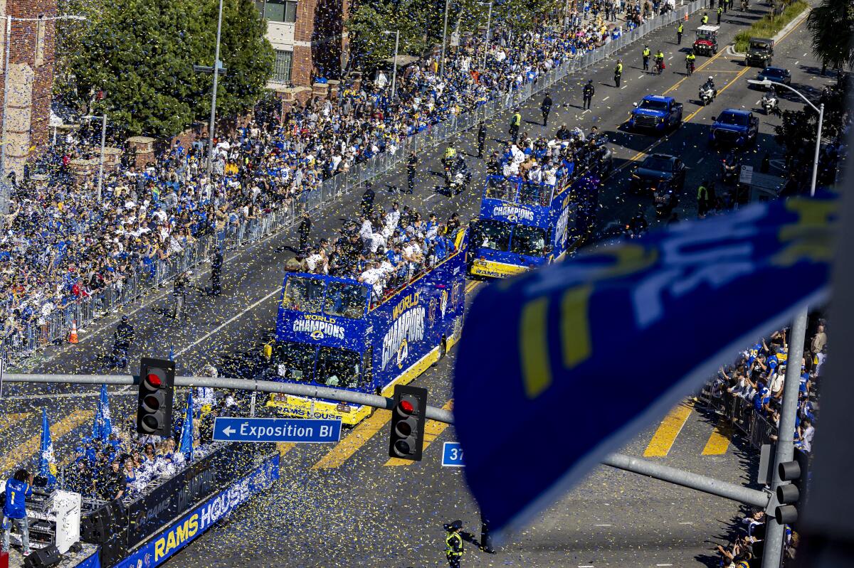 Fans cheer during the Rams Super parade to Exposition Park in Los Angeles. (Gina Ferazzi / Los Angeles Times)