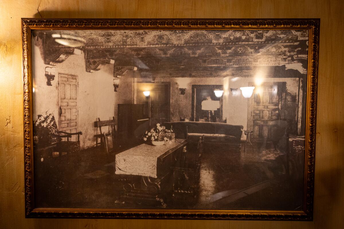 A framed vintage photo of an empty room.
