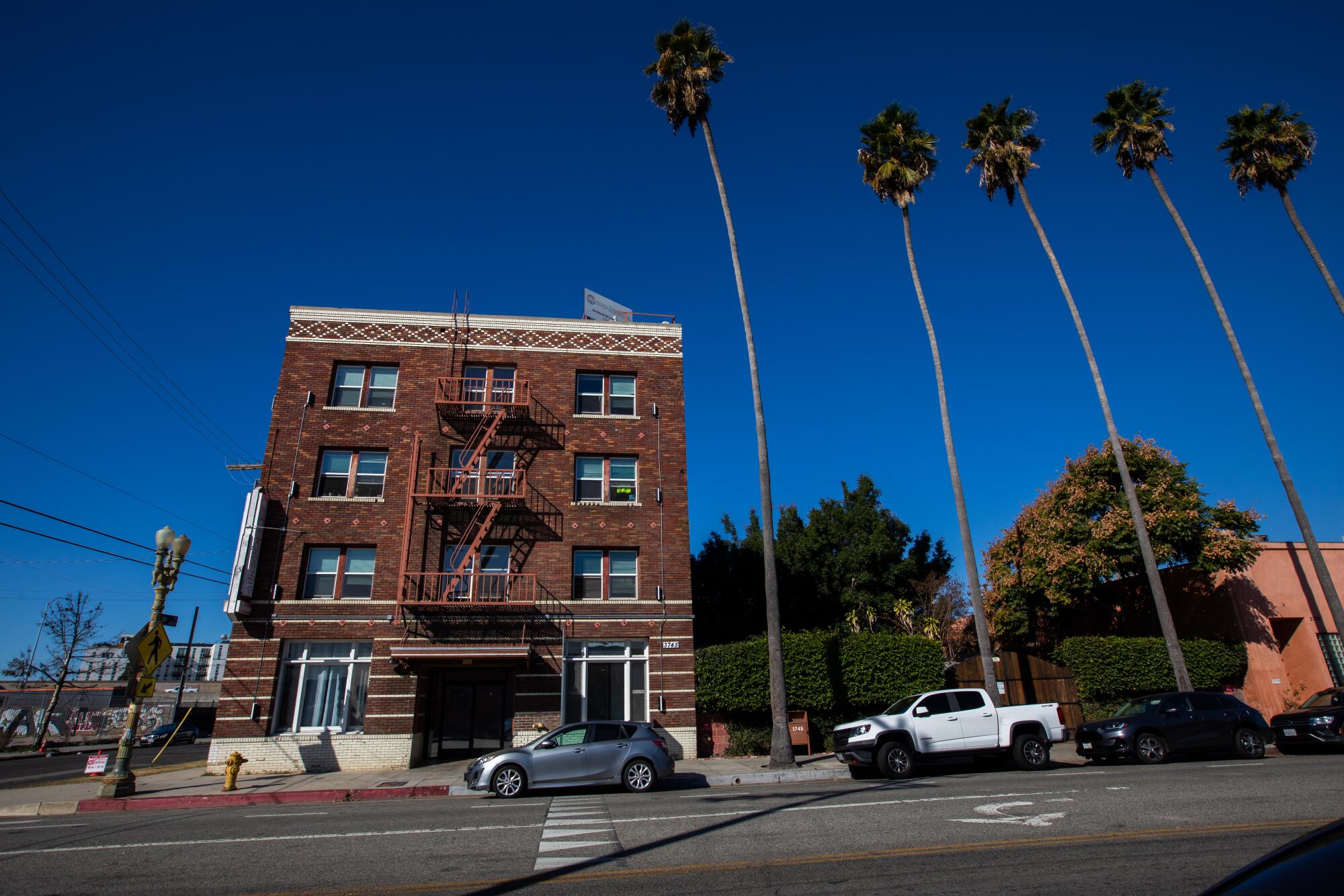 A four-story building with a brick exterior.