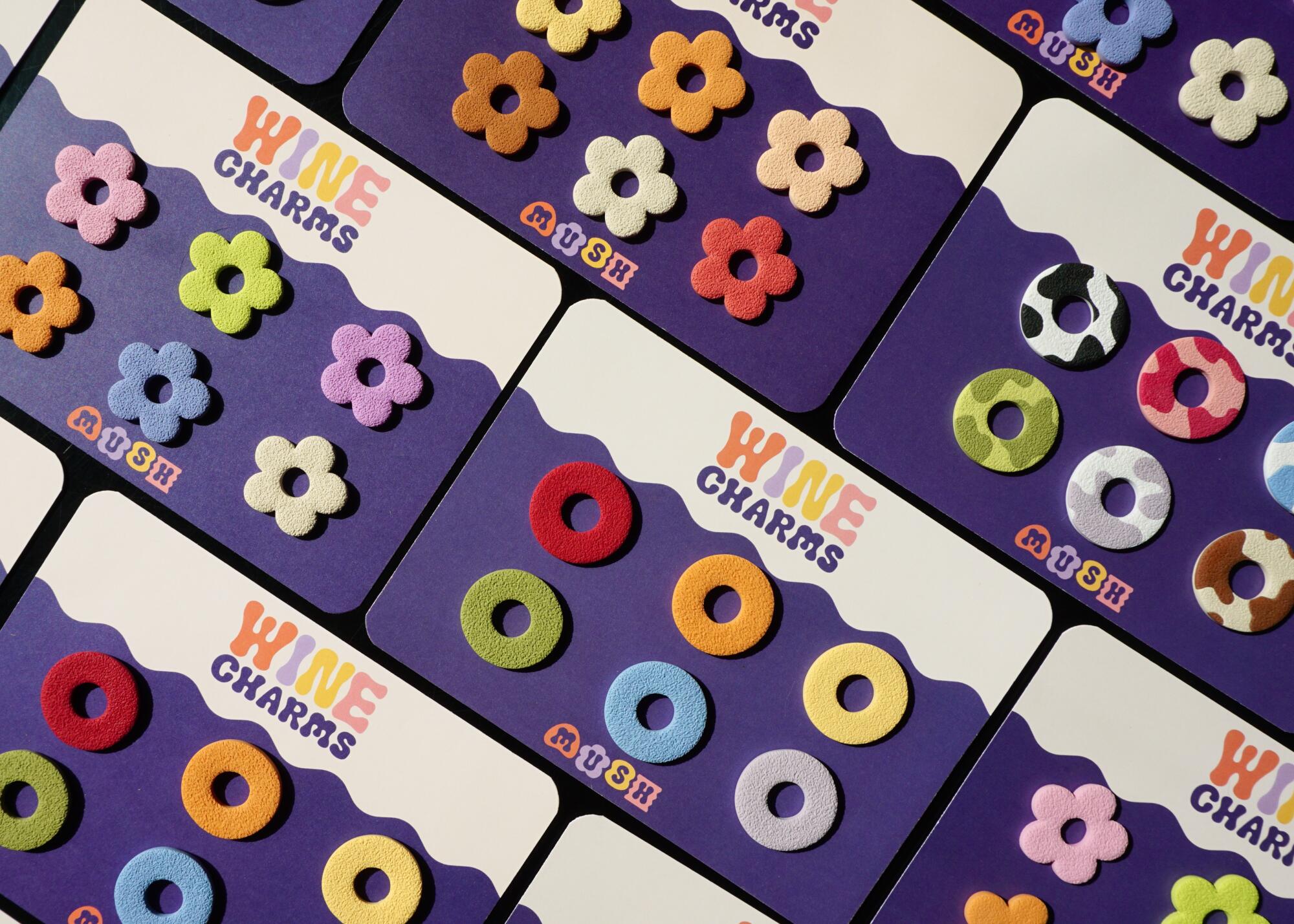 Colorful flower- and circle-shaped wine charms from Mush Bottega