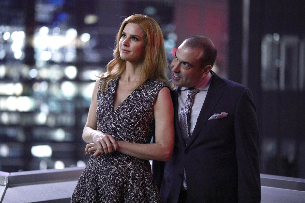 a woman and man in business attire