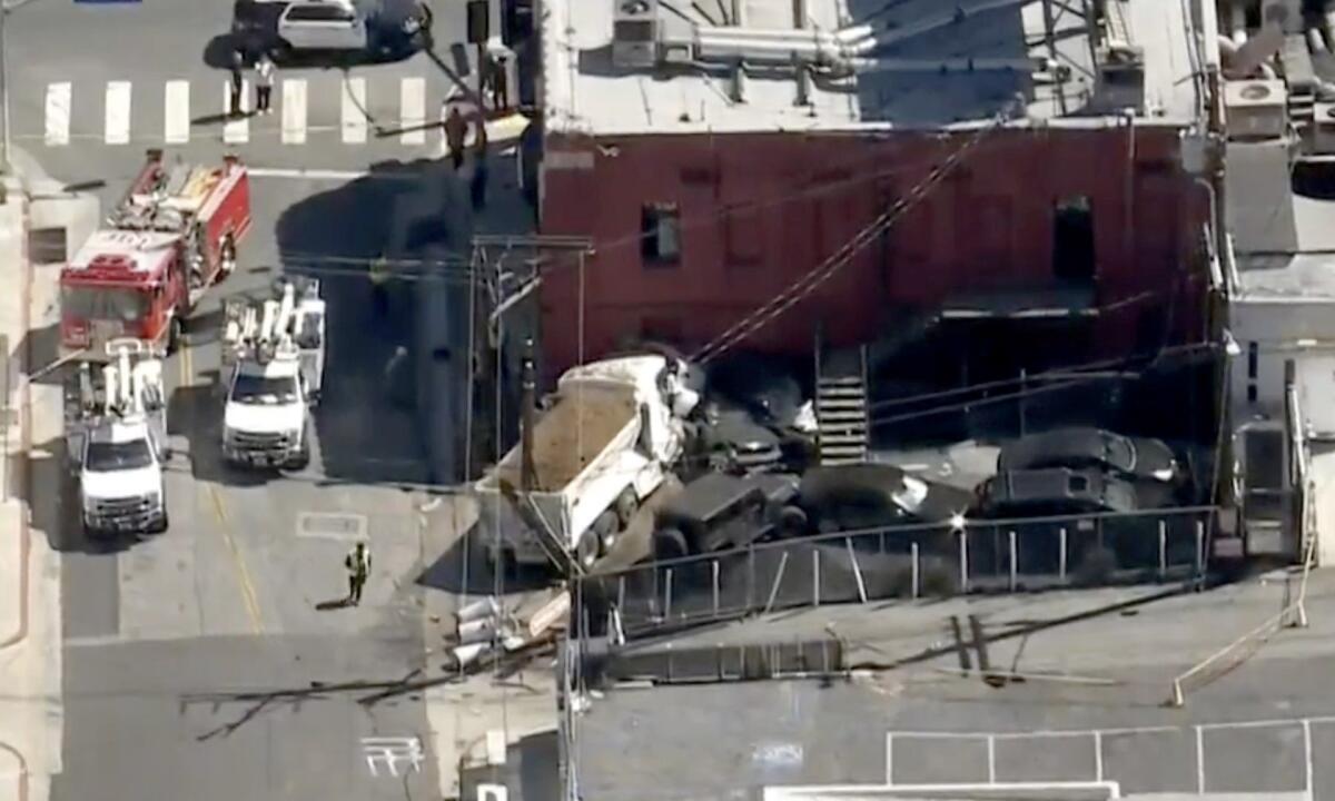 A dump truck crashed into a building.