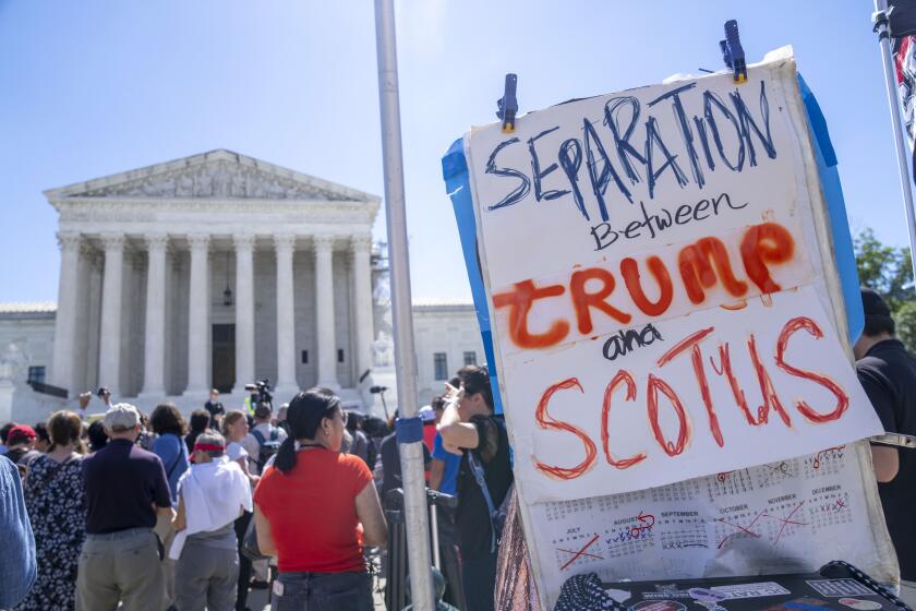 People protest, Monday, July 1, 2024, outside the Supreme Court in Washington, as decisions are announced. (AP Photo/Jacquelyn Martin)