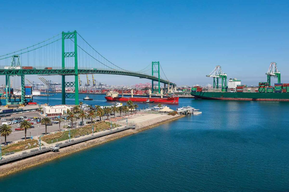 Vincent Thomas Bridge and container ships unloading in Los Angeles shipping port