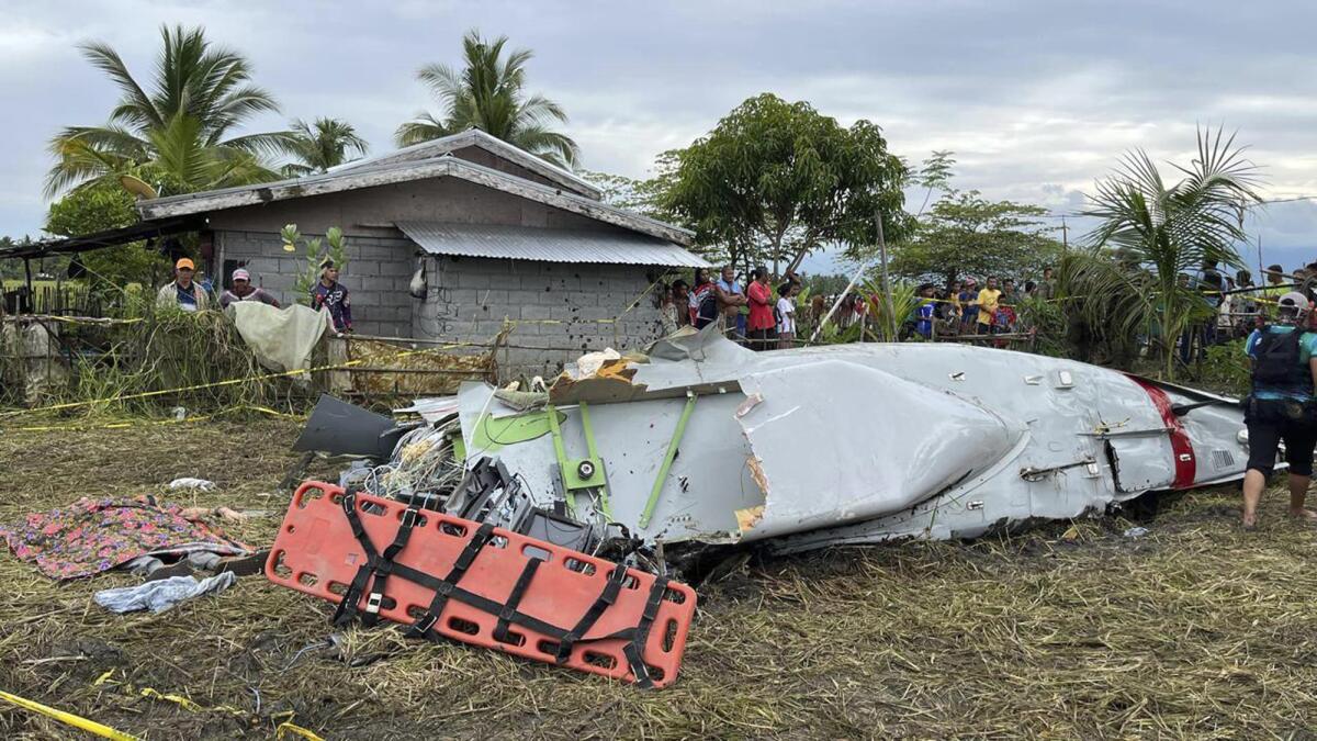 Wreckage of airplane in a rice field.