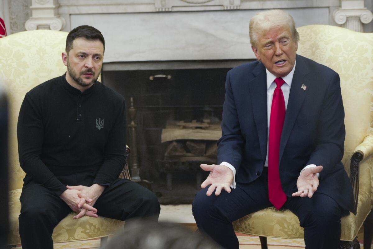 Ukrainian President Volodymyr Zelensky and President Trump sit next to each other. Trump has his hands on knees palm up.
