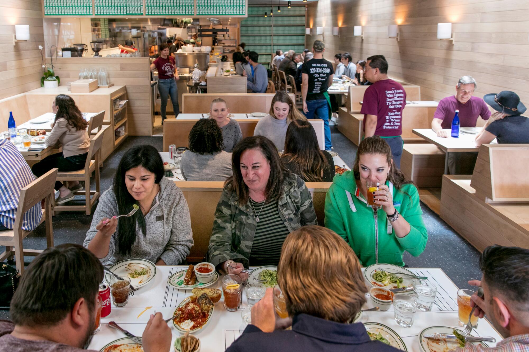 People in restaurant booths