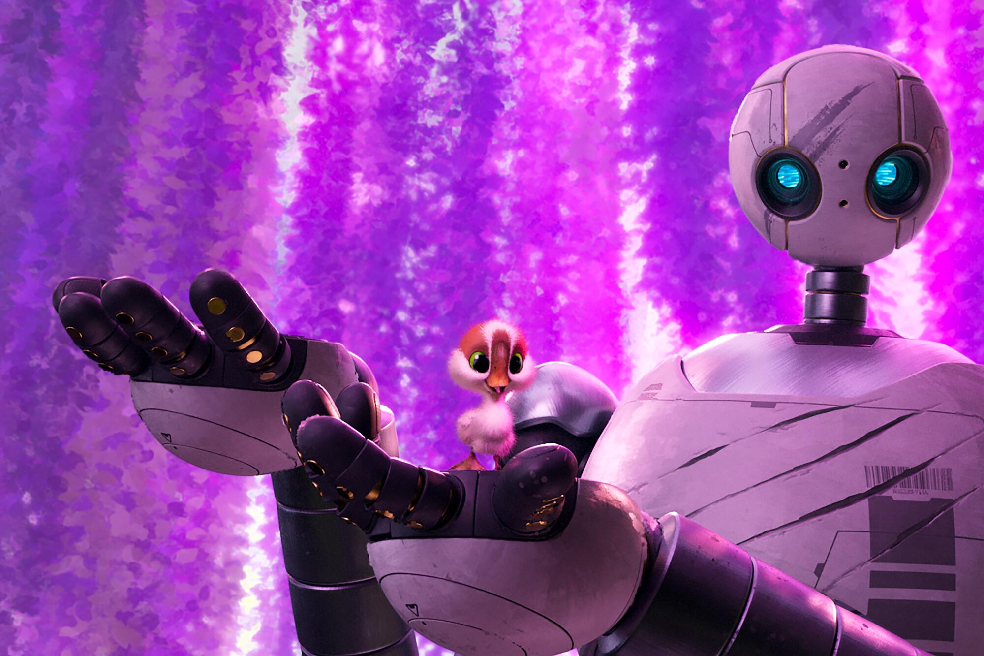 A metallic robot holds a little gosling in its hand in the animated "The Wild Robot."