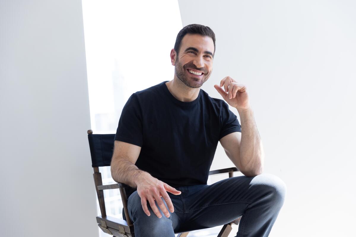 Man in a black shirt sitting in a chair