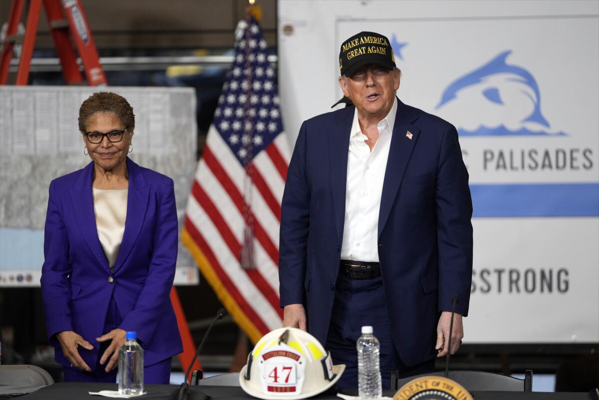 Los Angeles Mayor Karen Bass watches as President Trump speaks