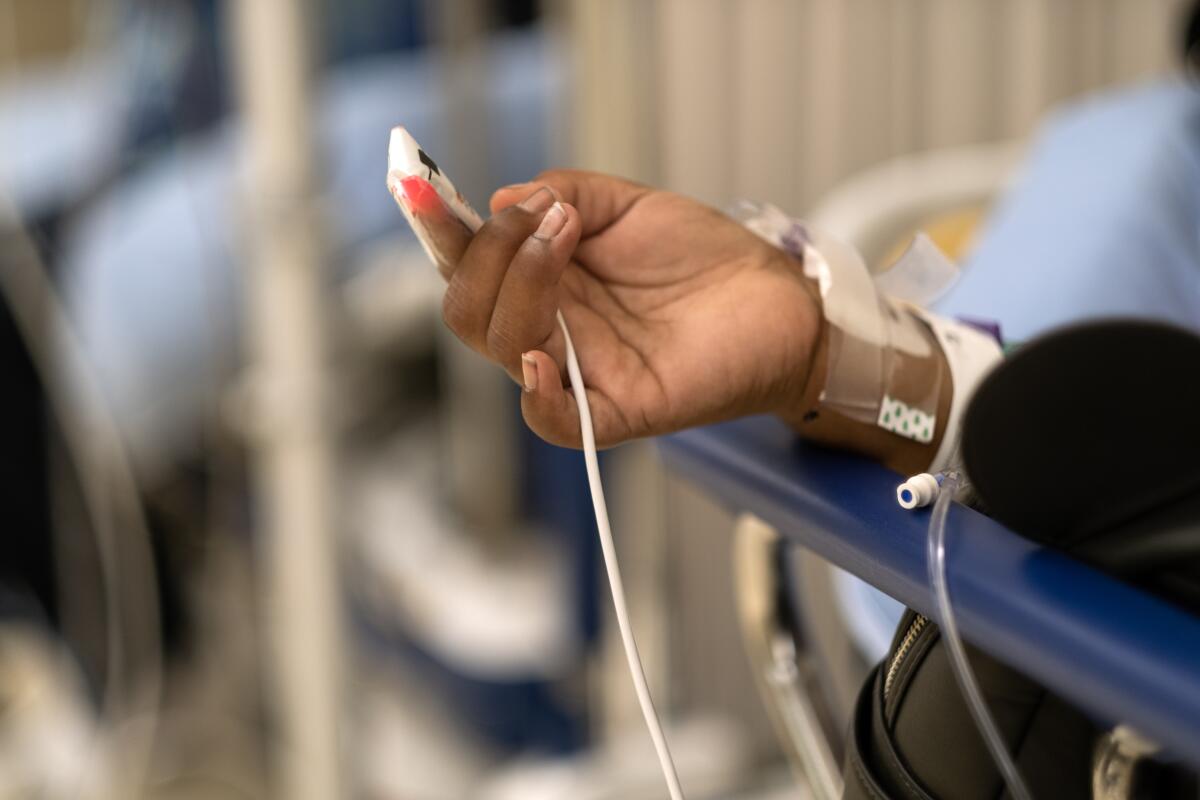 A patient rests on a gurney in a hospital in Los Angeles.
